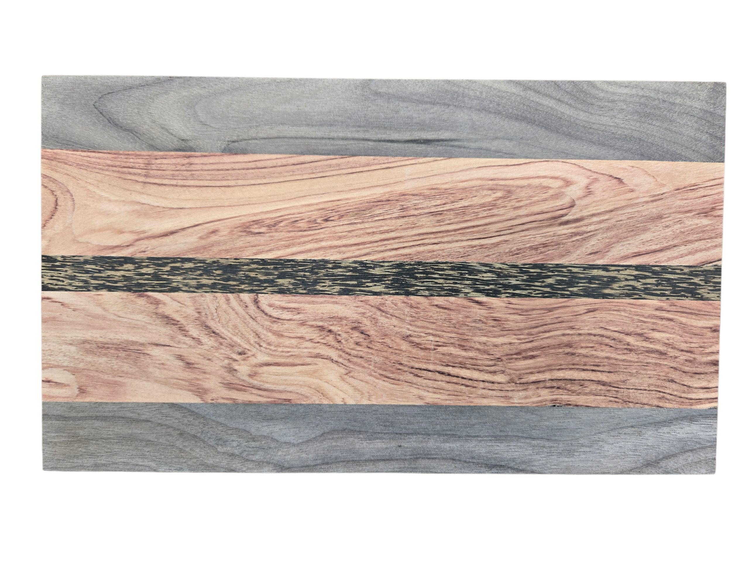 Close up of walnut pink ivory and black palmwood grain on cheese board