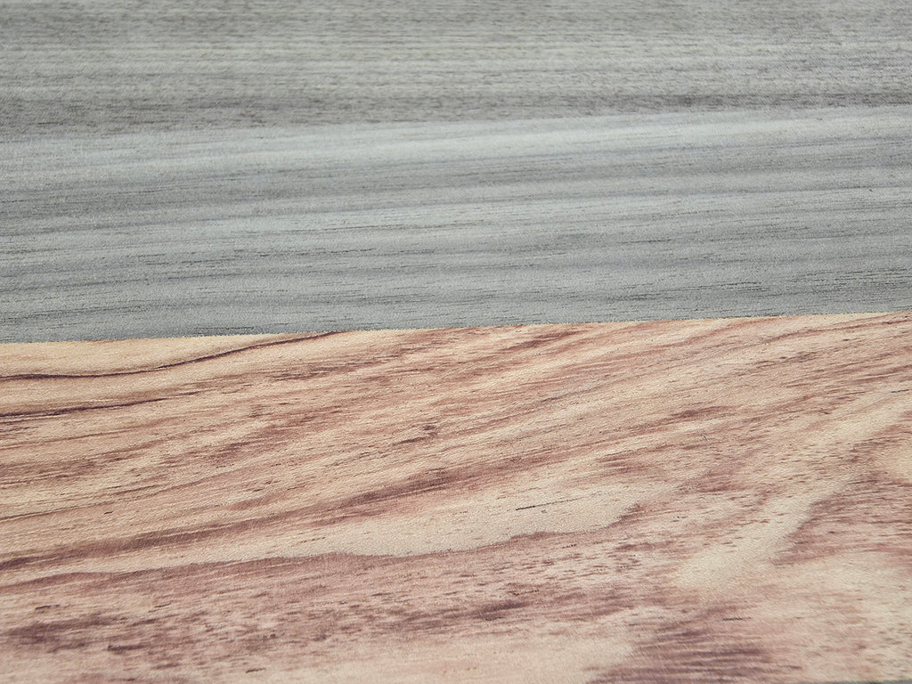 Close up of walnut and pink ivory wood grain on chopping board
